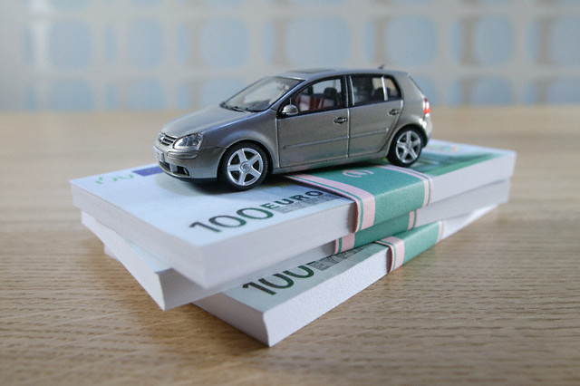 Toy Car on Stack of Euro Bills