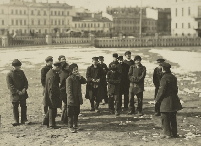 A group of St. Petersburg hooligans pitching pennies.