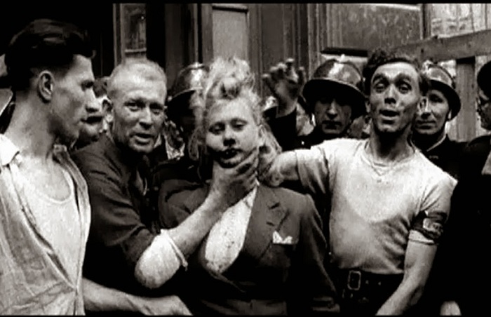 Публичное бритье головы женщины. Публичное бритье головы женщины.