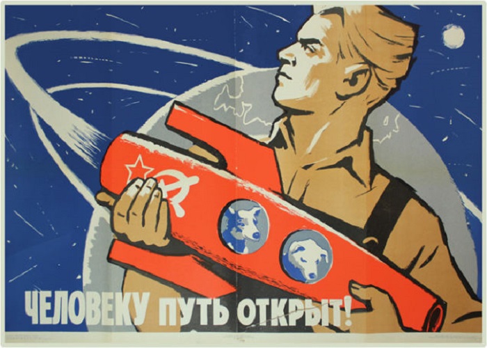 Рабочий держит в руках ракету, в которой сидят первые летчики собаки-Белка и Стрелка. Рабочий держит в руках ракету, в которой сидят первые летчики собаки-Белка и Стрелка.