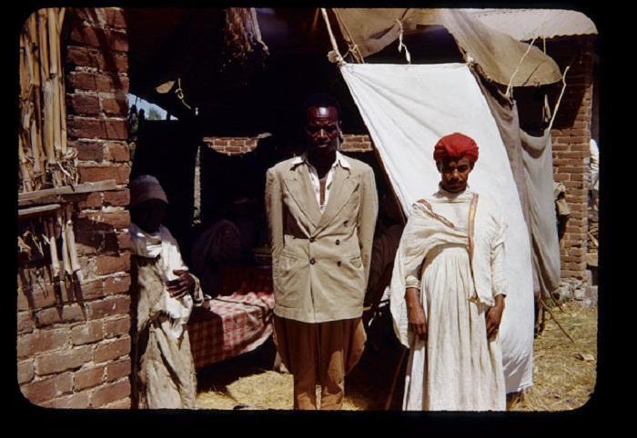 Двугорбый верблюд с поклажей на горбу и хозяином. Двугорбый верблюд с поклажей на горбу и хозяином.